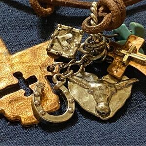 Turquoise silver and hammered copper Charms on leather Necklace